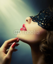Fototapety Beautiful Woman with Black Lace mask over her Eyes