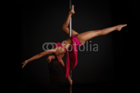 Naklejki Woman performing pole dance