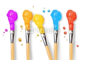 Bristle brushes full of different colored paints