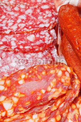 various sliced sausages on plate