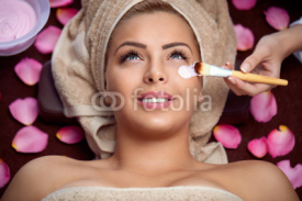 women receiving face treatment