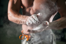 Fototapety talc on bodybuilding athlete hands on background muscular physique in preparation for training in the gym