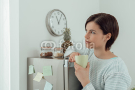 Woman having a coffee break at home