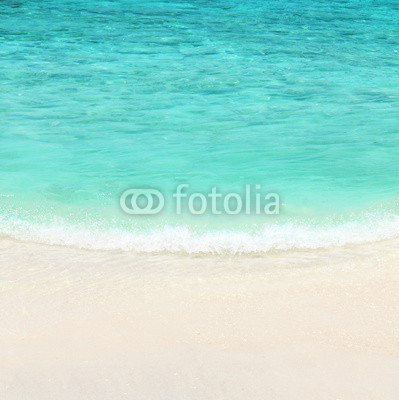 Turquoise water of the ocean and white sand