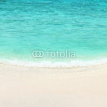Turquoise water of the ocean and white sand