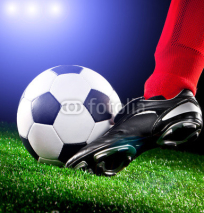 Naklejki soccer ball on the football field