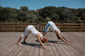 Healthy couple in yoga position