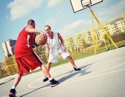 Two basketball players on the court