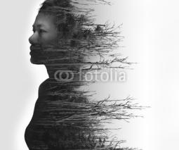 Double exposure portrait of young woman and dried forest