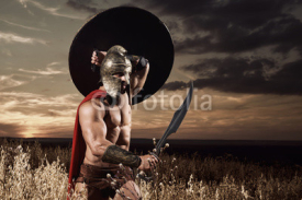 Spartan warrior going forward in attack with sword.