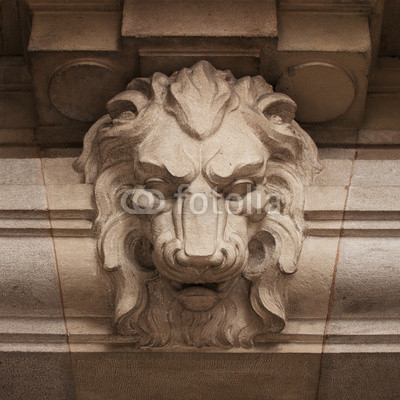 Muzzle ferocious lion carved in stone