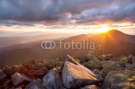 Fototapety Majestic sunset in the mountains landscape. Dramatic sky and col