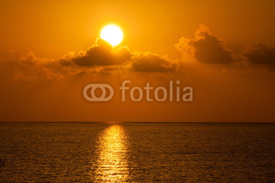 Fabulous sunset on a background of sky and sea.