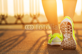 Naklejki Runner woman feet running on road closeup on shoe. 