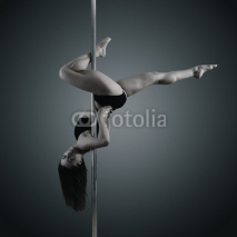Naklejki pole dancer, young woman dancing on pylon, toned and noise added