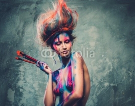 Woman muse with creative body art and hairdo