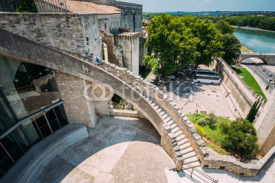 Man climbs the stairs to the walls of the fortress near the Pope