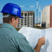 engineer reading construction plan