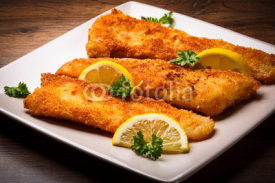 Naklejki Fish dish - fried fish fillet with vegetables