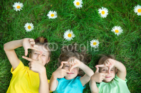 Group of happy children playing outdoors