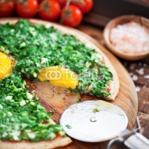 Pizza with herbs and eggs, selective focus