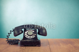 Fototapety Retro telephone on table in front mint green background
