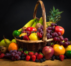 Fototapety Mix of fresh fruits on wicker bascket