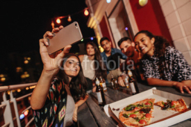 Group of friends making a selfie at rooftop party