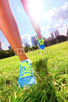 Runner - running shoes on woman athlete