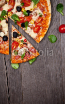 Naklejki Delicious italian pizza served on wooden table