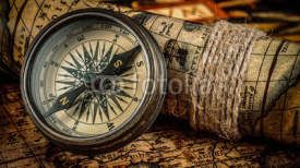 Fototapety Old vintage compass on ancient map