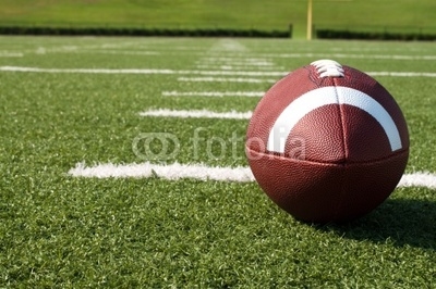 Closeup of American Football on Field