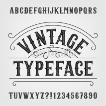 Fototapety Vintage typeface. Retro distressed alphabet vector font. Hand drawn letters and numbers. Vintage vector font for labels, headlines, posters etc.