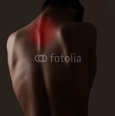 Woman suffering from pain in neck. Closeup
