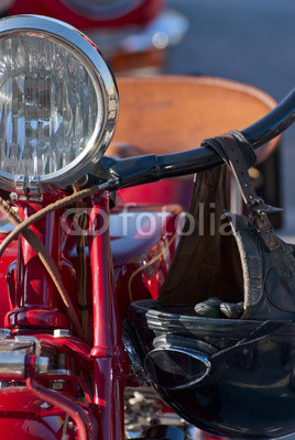 Front view of a red veteran motorbike
