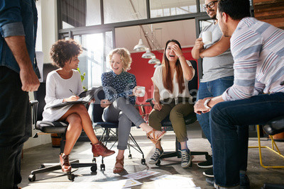 Group of young business professionals having a meeting