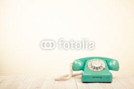 Obrazy i plakaty Retro mint green telephone on wooden table