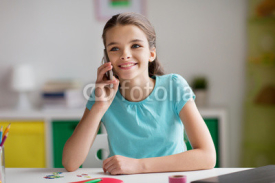 happy girl calling on smartphone at home