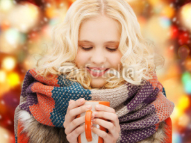 smiling teenage girl with tea or coffee mug