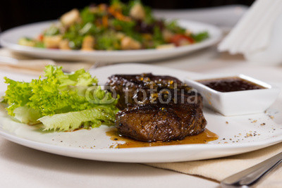 Juicy Steak on Plate with Garnish