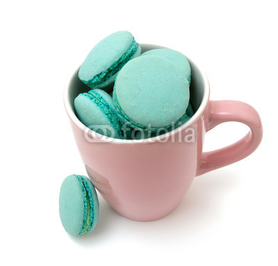 mint macarons in pink cup over white