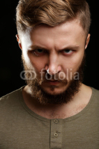 Naklejki Portrait of handsome man with beard on black background
