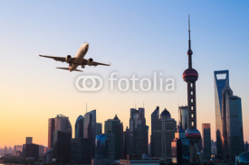 Fototapety modern city skyline with airplane