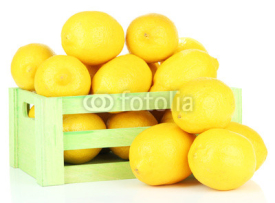 Fototapety Ripe lemons in wooden box isolated on white