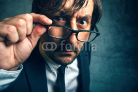 Fototapety Angry tax inspector looking serious and determined