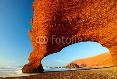 Red archs on atlantic ocean coast. Morocco