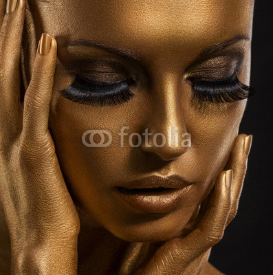 Gilt. Golden Woman's Face. Giled Make-up. Painted Skin