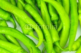 Fototapety Green peppers in the  plate isolated on white