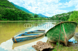 Naklejki Two boats in river on the picturesque landscape