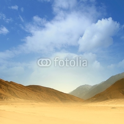 Beautiful image of a sand desert on a blue sky background